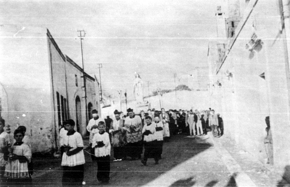 Roman Catholic priests leading a festive procession in S. Marzano di S. Giuseppe.