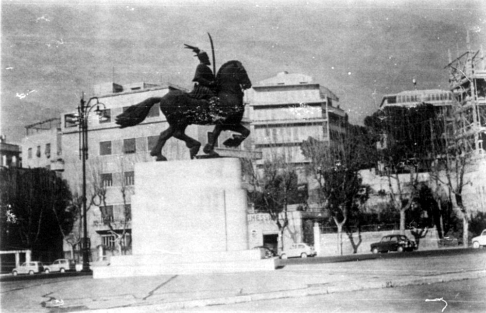 Equestrian statue of Scanderbeg on a tall pedestal in a city square